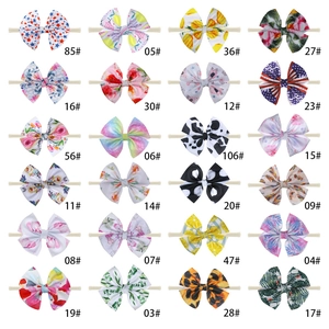 Selection of 24 colorful printed nylon baby headbands with various bow patterns and styles