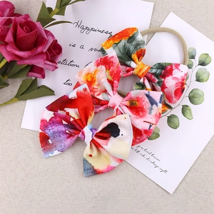 Three-piece set of floral bow headbands for infants with stretchy soft nylon straps