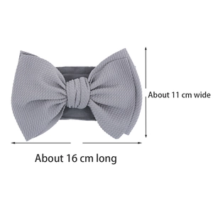 Detail of grey bow headband with textured knit fabric measuring 16cm by 11cm