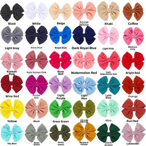 Detail showing 36 diverse candy-colored waffle fabric bow hair clips for kids
