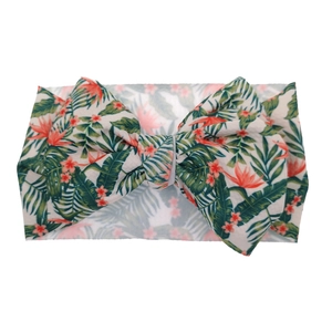 Baby headband with tropical palm leaf floral print and large decorative bow detail