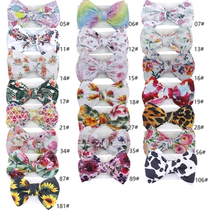 Collection of soft bow headbands for babies with various colorful graffiti and floral prints