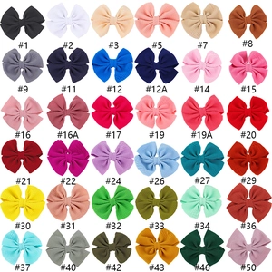 36 pieces of colorful waffle fabric hair bows for girls in a neat grid display