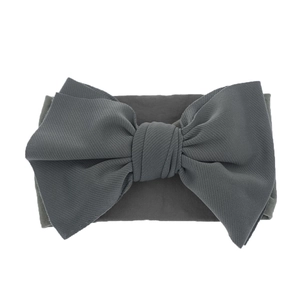 Detailed view of dark grey nylon baby headband with soft texture and large bow detail