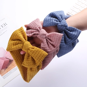 Lot de trois bandeaux bébé en maille gaufrée avec grands nœuds jaune rose et bleu