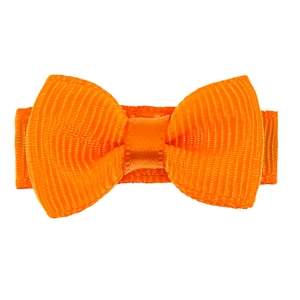Vue détaillée d'une barrette à cheveux avec nœud en ruban gros-grain orange vif