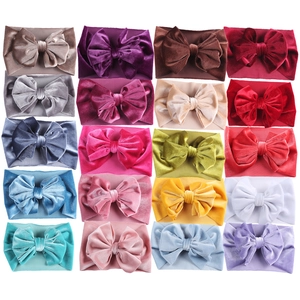 Detailed grid view showing 20 colors of elastic velvet bow headbands for babies