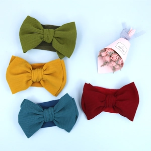 Set of four textured bow headbands for babies in olive, ginger, peacock blue and burgundy