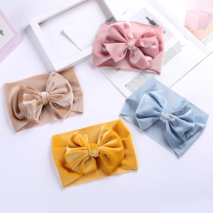 Set of 4 velvet bow baby headbands in pink, beige, blue and yellow for toddlers