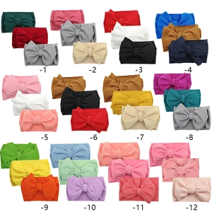 Set of 12 waffle knit baby bow headbands in various colors for infants and toddlers