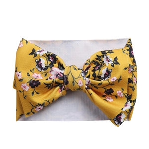 Floral print baby headband with large yellow bow and soft elastic fabric for infants