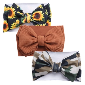 Detailed set of three baby bow headbands featuring sunflower, terracotta, and camo prints