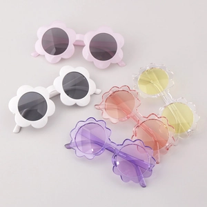 Detailed close-up of sunflower shaped children's sunglasses in five bright pastel colors