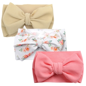 Three-piece baby headband set with large waffle texture bows in solid and floral prints