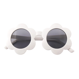 Detailed close-up of matte white sunflower-shaped frames with dark round lenses for kids
