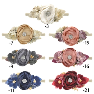 Detailed set of 7 colorful handmade flower headbands with rhinestones for babies