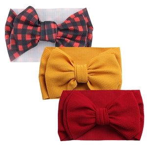 Three-piece baby headband set featuring plaid, yellow, and red waffle knit bow details