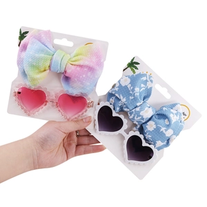 Kids heart-shaped sunglasses and floral bow headband sets for stylish fashion accessory