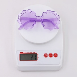 Purple sunflower shaped kids sunglasses made of lightweight plastic weighing only 21g