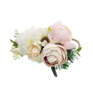 Floral baby headband with soft pink peonies and white daisies on a stretchy nylon band