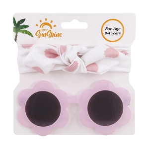 Dettaglio occhiali a fiore rosa e fascia a pois su cartoncino per bambini piccoli
