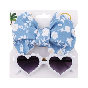 Detail view of blue floral bow headband and white heart-shaped sunglasses set