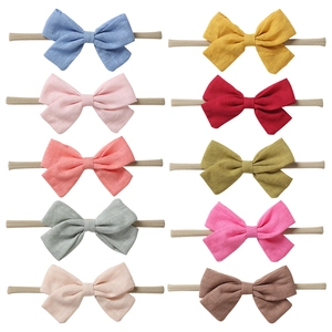 Set of 10 colorful linen bow baby headbands with soft elastic nylon straps for infants