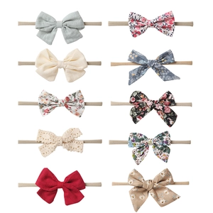 10-piece baby nylon headband set with assorted cotton linen bows and floral patterns