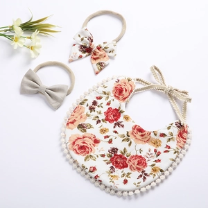 Floral baby bib and headband set with vintage flower prints and soft pom pom lace