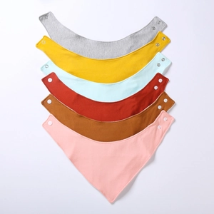 Detailed close-up of six-pack cotton baby bibs with adjustable snap buttons in diverse colors