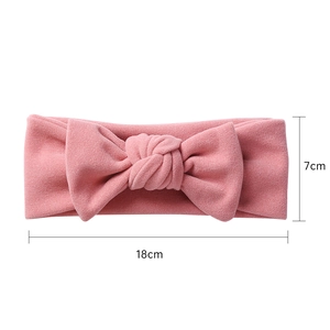 Detailed view of pink bow headband for babies with 18cm x 7cm size dimensions
