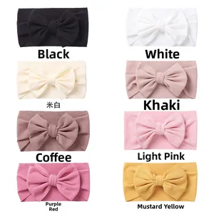 Detailed grid showing 8 colors of baby elastic ribbed knit headbands with big bows