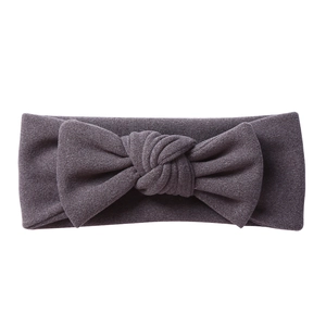 Close-up of deep purple baby headband with soft high-elastic fabric and large bow knot