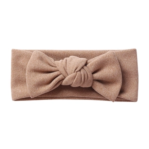 Detail of soft brown knit baby headband showing the textured bow and high elasticity fabric