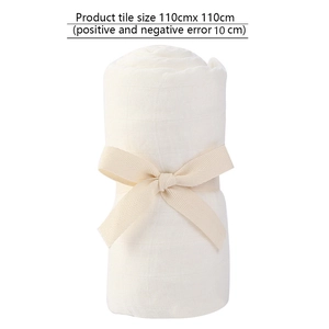 Detail of soft bamboo cotton baby swaddle with ribbon bow and 110x110cm size dimensions