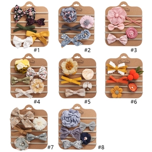 Baby headband sets featuring floral bows and lace decorations in diverse colors