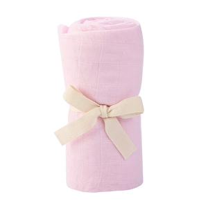Detail of soft pink bamboo cotton baby wrap with decorative herringbone ribbon tie