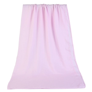 Detail of light pink soft bamboo cotton baby swaddle wrap with breathable gauze texture