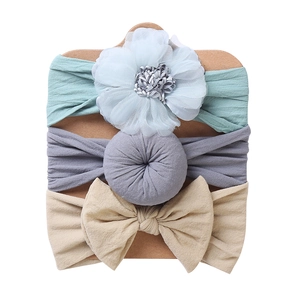 Three-piece baby headband set with mesh flower, donut knot, and large beige bow styles