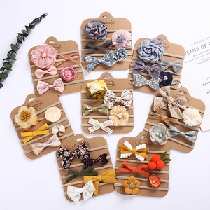 Five-piece set of baby nylon headbands with floral fabric bows on display cards