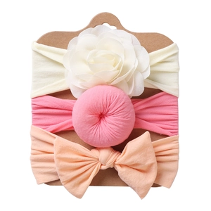 Three-piece baby headband set featuring floral bows and soft elastic nylon fabric