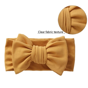 Macro detail of mustard yellow ribbed cotton fabric for baby bow headband accessory