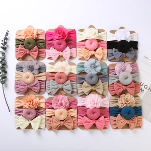 36-piece baby headband set with fabric flowers and bows on display cards