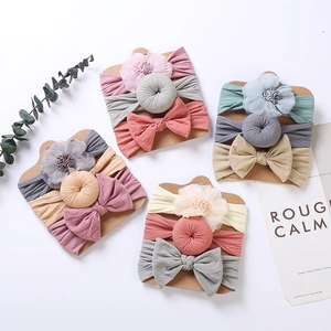Three-piece baby headband set with floral patterns and cute bows in Morandi tones