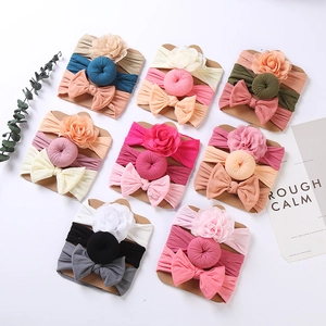3-pack elastic baby headbands with fabric flowers and bows in assorted colors