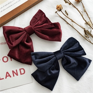 Elegant large velvet bow hair clips in wine red and navy blue for hair styling
