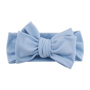 Close-up detail of light blue ribbed knit fabric and large bow on baby headband