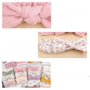 Detailed macro view of soft cotton baby bow headbands with elastic fabric texture