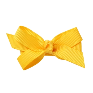 Detail view of a bright yellow floral grosgrain ribbon bow hair clip for young girls