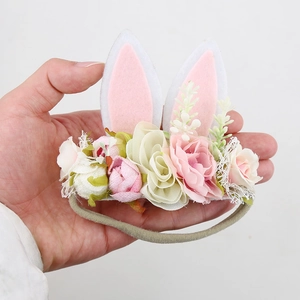 Elastic baby headband with Easter bunny ears and colorful artificial flowers